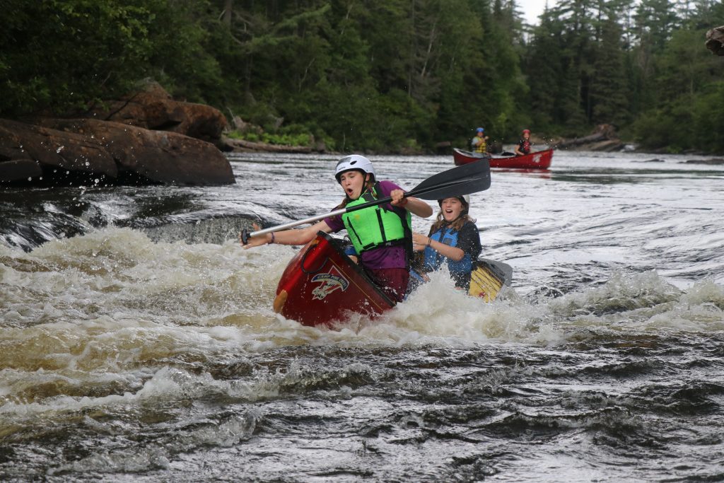 Canoe tripping in a rapid on the Noire River
