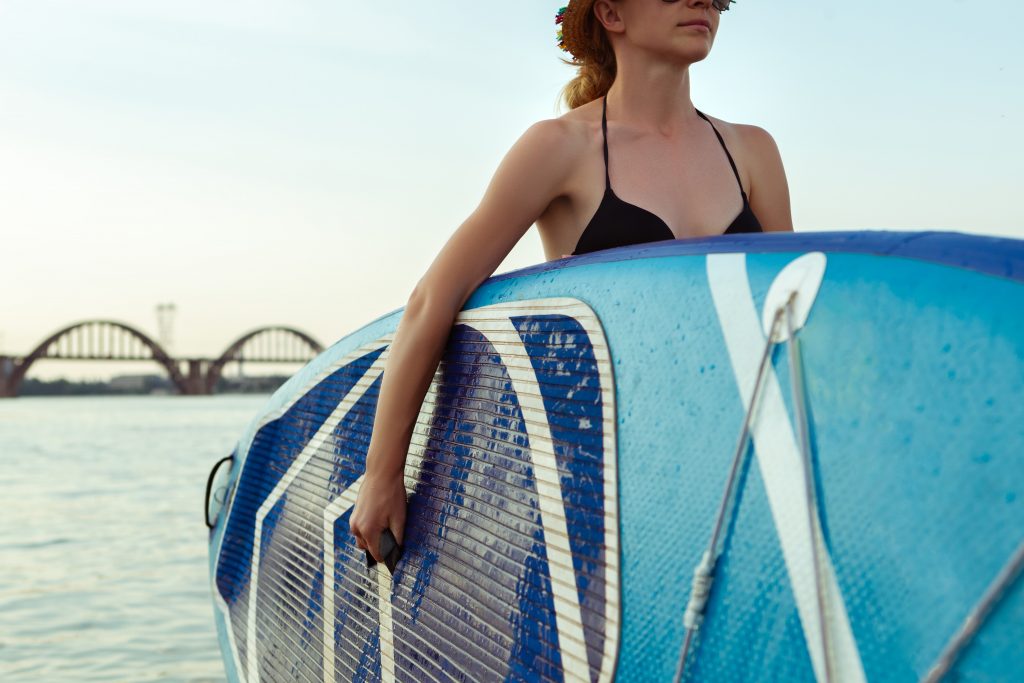 Woman with a SUP board
