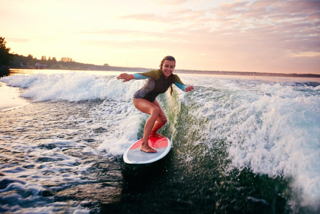 Young woman surfboarding 